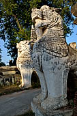 Myanmar - Inwa,  lions guarding enterance to Mahar Aung Mye Bon San Monastery